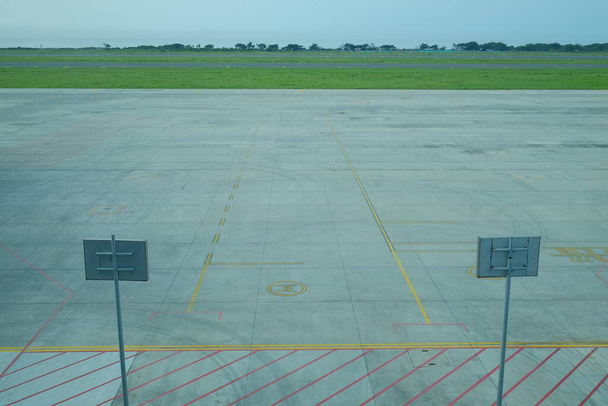 Empty aircraft parking area around the runway complex.  - Photo, Image