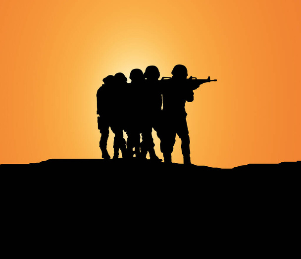 sziluett katona fegyverrel keresés közben terrorista a hegyen - Fotó, kép