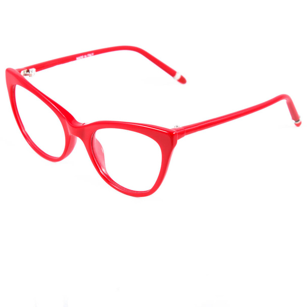 Red glasses frames on white background. Sun goggles and glasses for vision in red frames. - Fotó, kép
