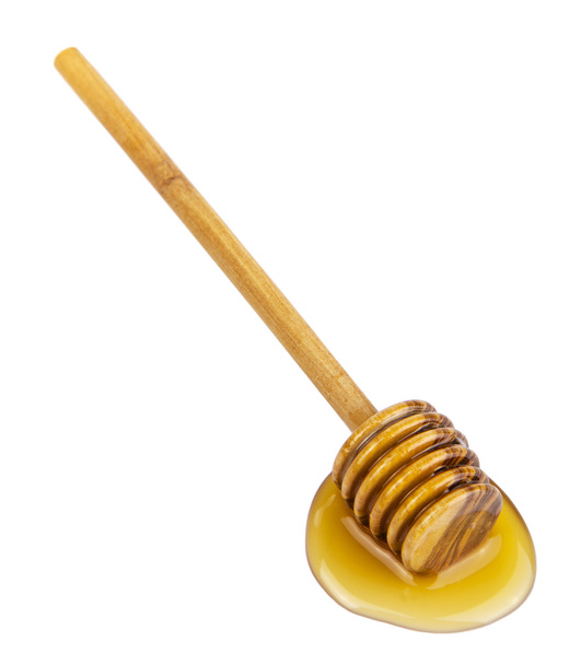 Honey and wooden dipper isolated - Photo, Image