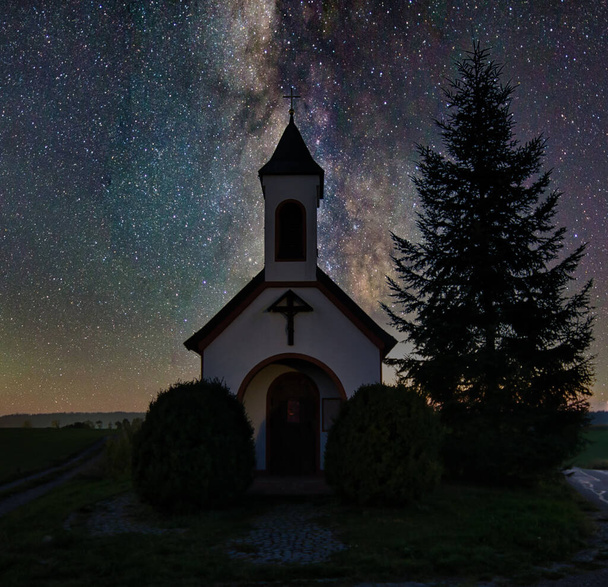 The beautiful view of a small church and a milky way sky - Valokuva, kuva