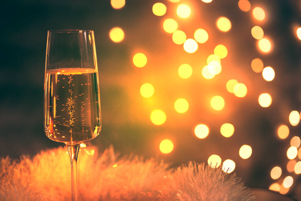 champagne glass with sparkler, festive background, vintage colors - Fotó, kép