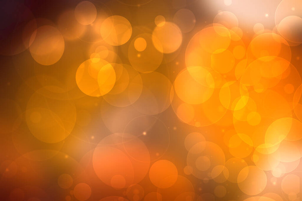 A festive abstract delicate golden yellow orange gradient background texture with glitter defocused sparkle bokeh circles and stars. Card concept for Happy New Year, party invitation, valentine or other holidays. - Foto, Bild