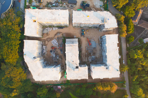 Aerial top view of apartment in village under construction site with structure. Top view of precast concrete slap floor. Development architecture buildings. - 写真・画像
