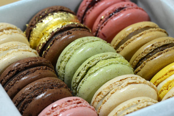 Colourful tasty macaroons in a row - Photo, Image