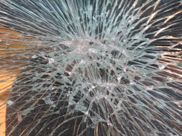 Smashed window glass useful as risk or danger concept - Photo, Image