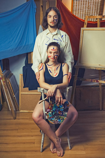 art portrait of a young couple. artist man and woman body art - Photo, image