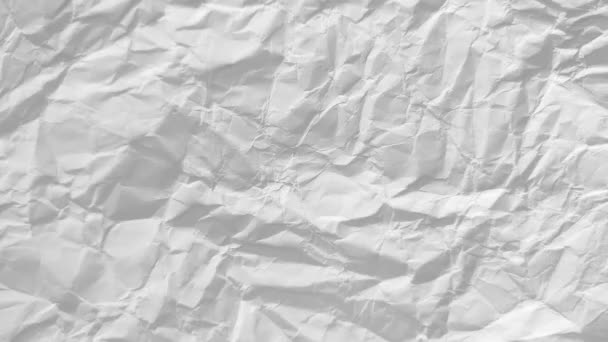 Stop-Motion-Animation des weißen zerknüllten Papierhintergrundes. Leeres Blatt Papier. Raum für Text. Frame-by-Frame-Stoppbewegungssequenz. Video-Luma matt. Nahtloses Looping - Filmmaterial, Video