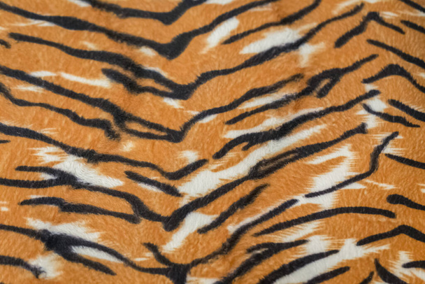 artificial tiger skin pattern baackground - Fotografie, Obrázek