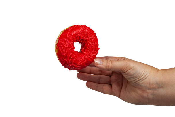 Woman holding a donut in her hand isolated on white background. - Foto, Bild