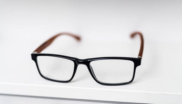 Eyeglass lenses close up view. Eyewear correction stylish frame with glasses. - 写真・画像