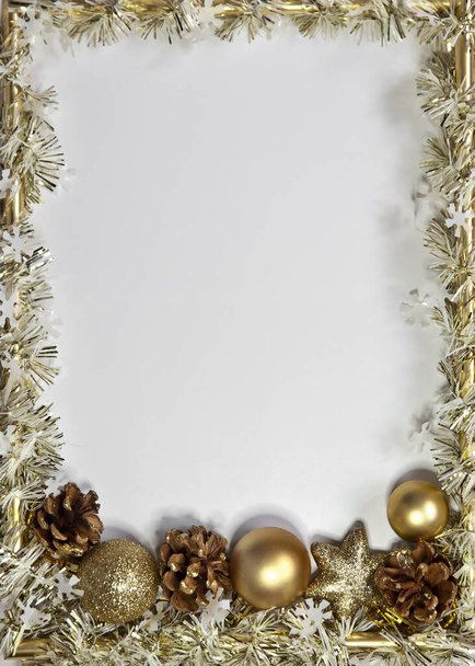 Photo frame, golden decorations on white background. Christmas, winter, new year concept. Flat lay, top view, copy space. - Foto, immagini