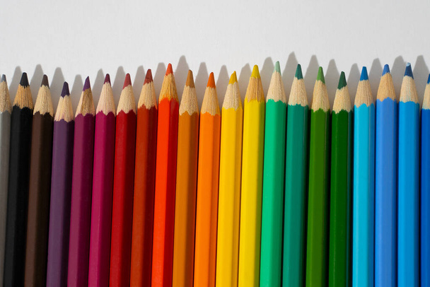 Sharpened bright pencils on white isolated background, place for text - Fotoğraf, Görsel