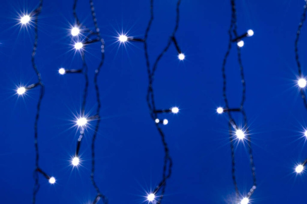 abstract Christmas lights background on blue - Foto, imagen