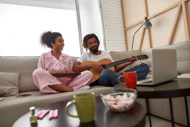 Man and girl play on musical instruments at home - Foto, immagini