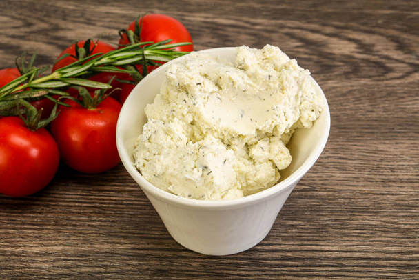 Soft cream cheese with herbs in the bowl - Photo, Image