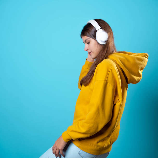 Music lover, a young woman with headphones, listening to music. - Foto, Imagen