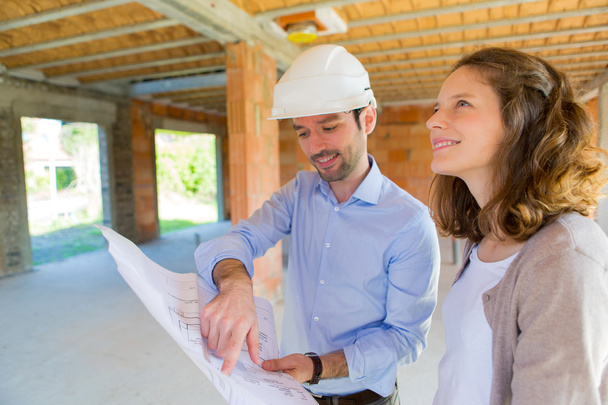 Young woman and architect on construction site  - Foto, Imagem