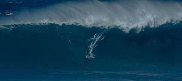 Sport photography. Jaws swell on International surfing event in Maui, Hawai 2021 December. - Photo, Image