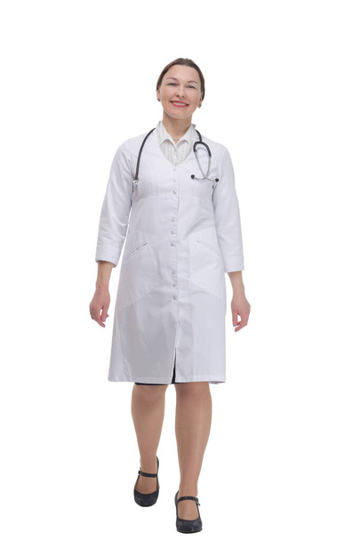female doctor with a stethoscope striding forward . - Фото, изображение