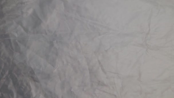 full frame background of panning crumpled polyethylene film - Filmati, video