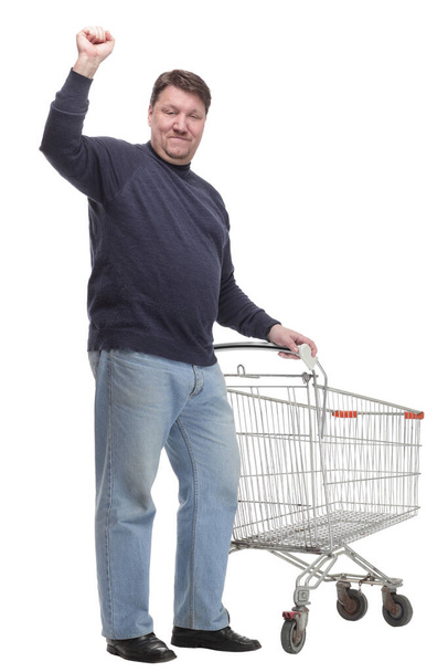 in full growth. casual mature man with shopping cart . - Zdjęcie, obraz
