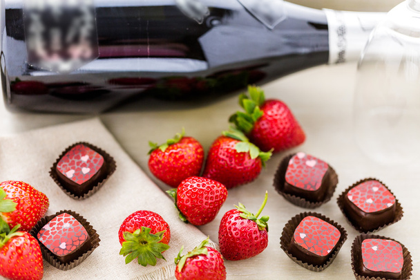 Strawberries and champaigne chocolate truffles. - Photo, Image