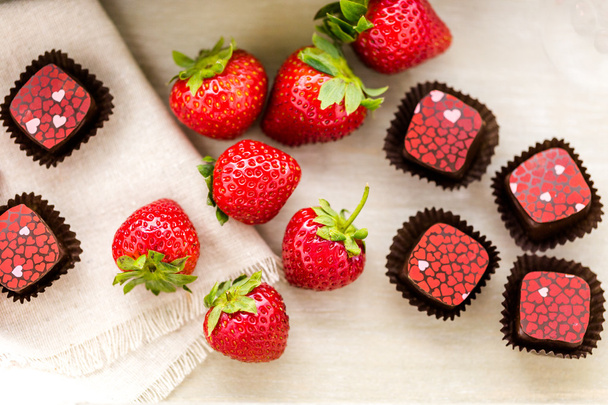 Strawberries and  chocolate truffles. - Photo, Image