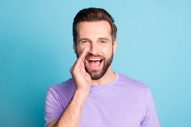 Photo of young man happy positive smile hand touch face announce speak tell news isolated over blue color background - Foto, Imagen