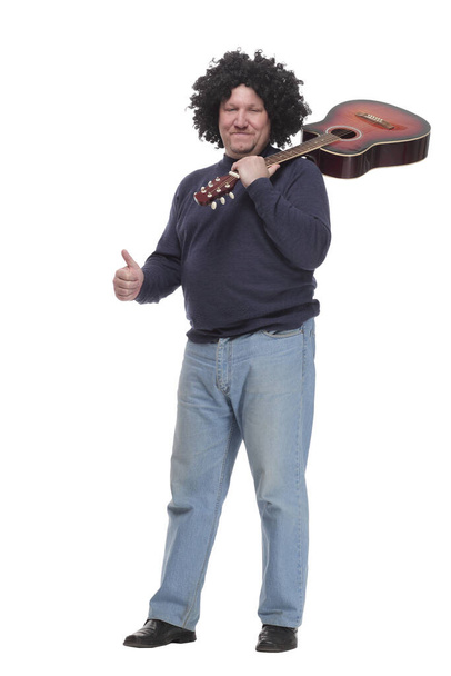 in full growth. curly-haired mature man with a guitar. - 写真・画像