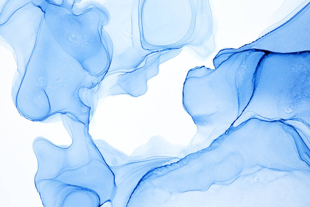 An abstract blurry smeared blue watercolor spot on a white background - 写真・画像