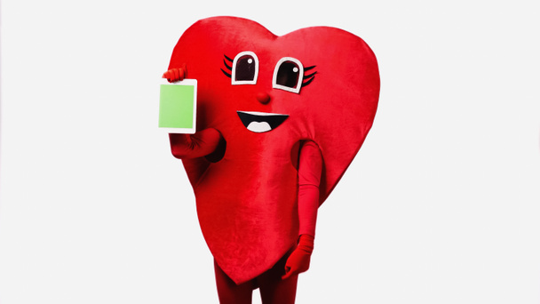 person in red heart costume holding digital tablet with green screen isolated on white - Foto, Imagem