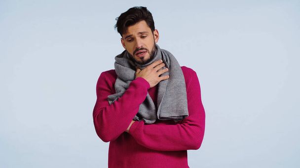 sick man in sweater and scarf having sore throat isolated on blue  - Fotografie, Obrázek