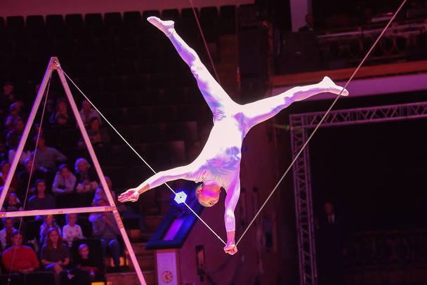 Minsk, Belarus - September 27, 2019: Tightrope walker. Li Wei. Chinee. II Minsk International Circus Art Festival. - Фото, изображение