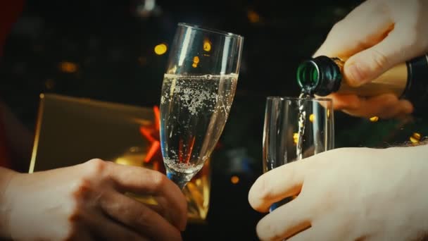 Pouring champagne into a glass. Celebrating new year or christmas. - Footage, Video