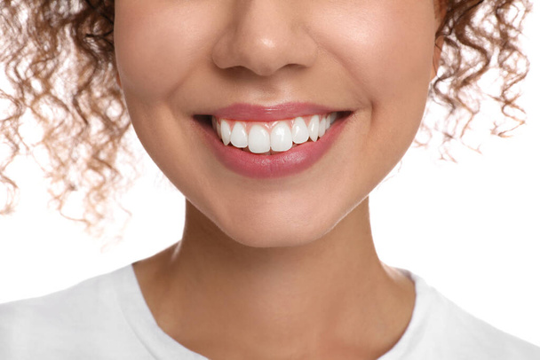Young woman with healthy teeth on white background, closeup - Φωτογραφία, εικόνα
