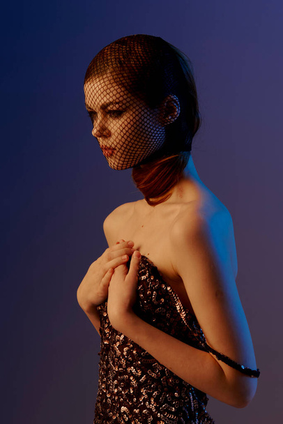 photo pretty woman in a shiny dress posing luxury isolated background - Foto, Bild