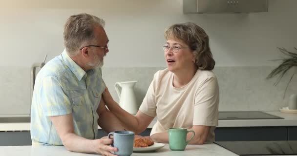 Caring retired woman support encourage beloved man stroke his shoulder - Felvétel, videó