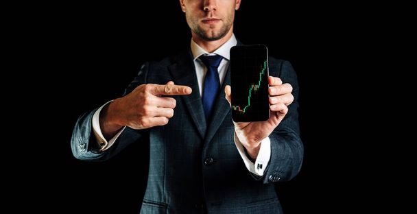 Sell and buy. Investment business technology app on digital screen in businessman hands. Finance application for sell, buy and analysis profit dividend statistics. Candlestick chart banner - 写真・画像