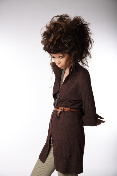 Glamorous Woman in Brown Jacket Looking Down - Fotoğraf, Görsel
