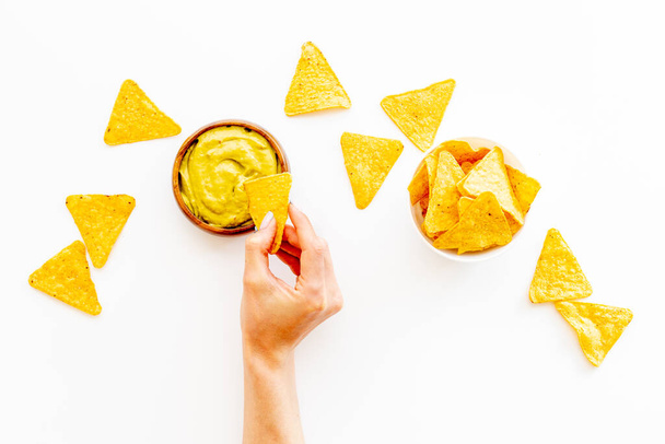 Mexican snacks nachos with guacamole sause. Fast food background - Zdjęcie, obraz
