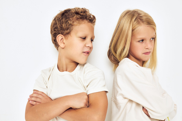 Image of boy and girl fight naughty light background - Foto, Imagen