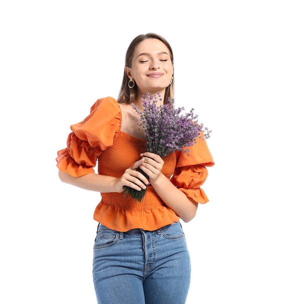 Beautiful young woman with bouquet of lavender on white background - Fotoğraf, Görsel