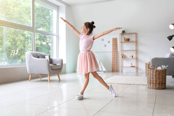 Adorable little ballerina dancing at home - Foto, Imagem