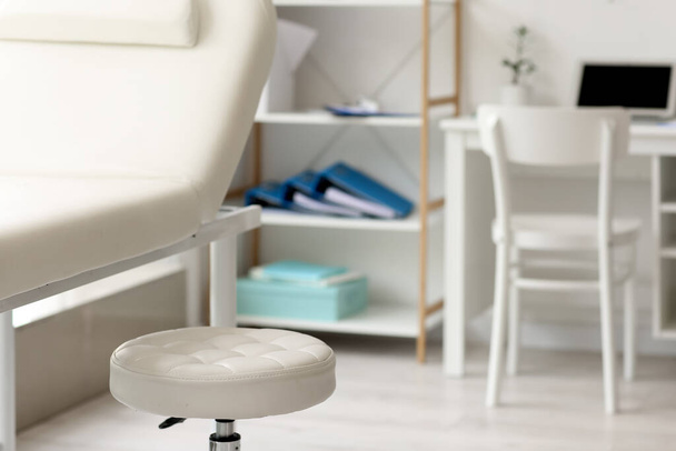 Medical couch with stool in doctor's office, closeup - Photo, Image