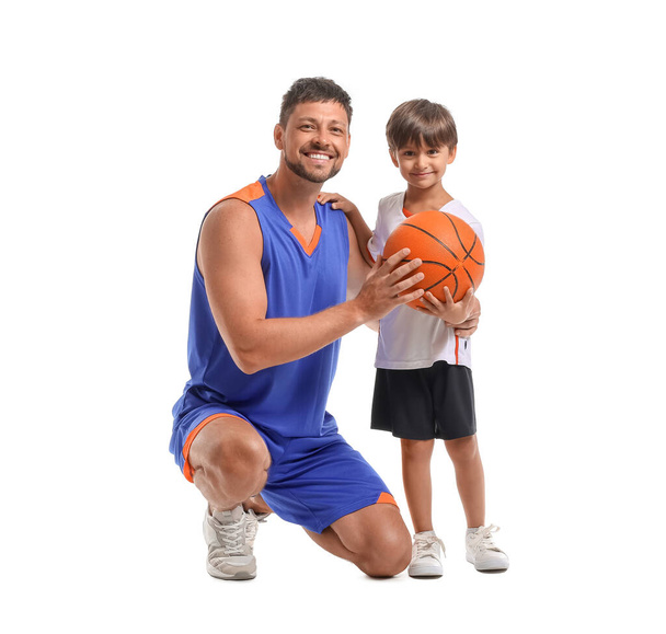 Little boy with ball and his trainer on white background - Foto, imagen