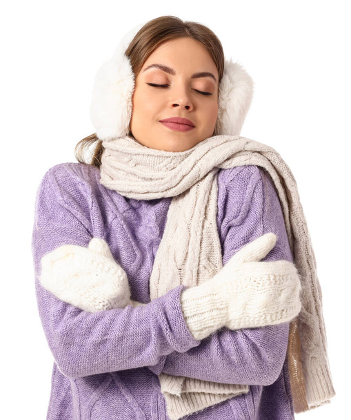 Beautiful young woman in warm winter clothes on white background - Photo, Image
