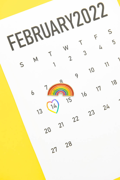 Calendar with marked date of Valentines Day on color background. LGBT concept - Photo, Image