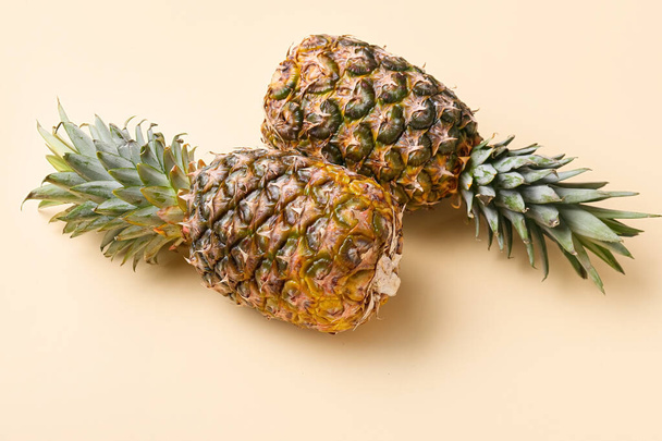 Two fresh pineapples on color background - Foto, Bild