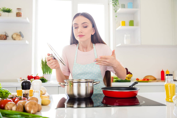 Photo portrait young woman cooking soup smelling scent - Fotografie, Obrázek